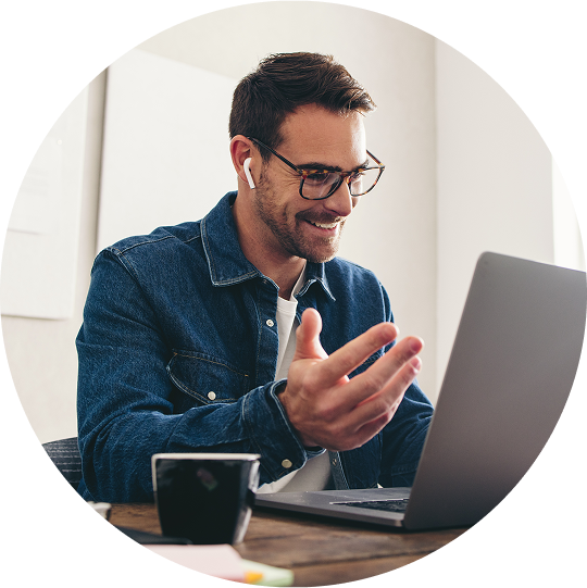 image of man in front of laptop